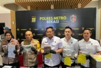 1764500696065-polres-metro-bekasi-mengungkap-kasus-dana-hibah-atlet-difabel-1764249760587_43